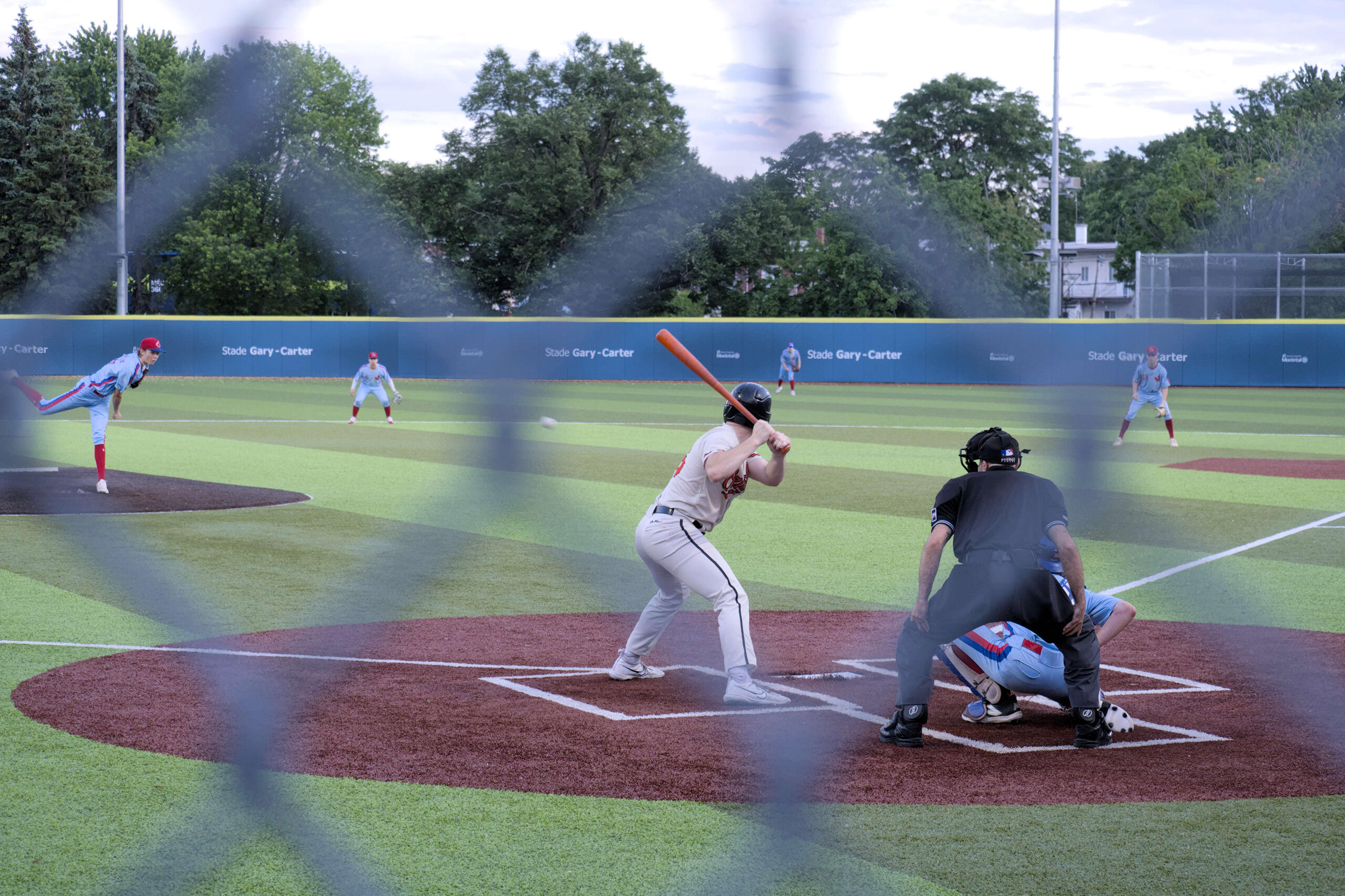 Two teams playing baseball in Northern Montreal